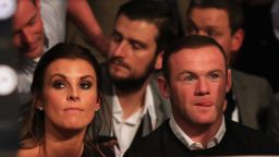 MANCHESTER, ENGLAND - SEPTEMBER 24:  Manchester United and England footballer Wayne Rooney (R) and wife Coleen look on from ringside at Manchester Arena on September 24, 2016 in Manchester, England.  (Photo by Ben Hoskins/Getty Images)