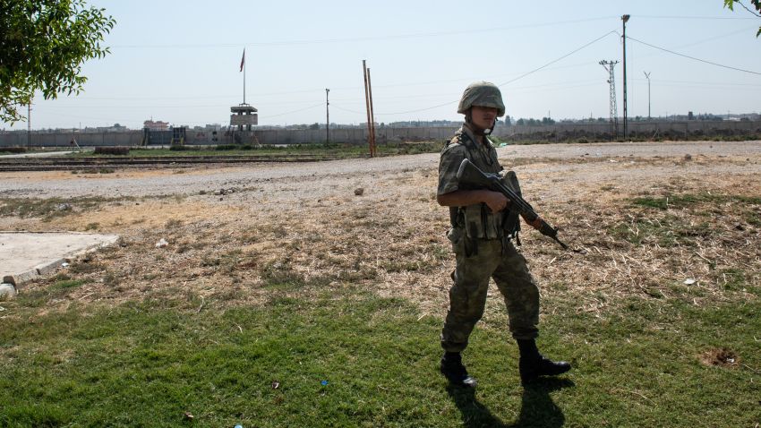 AKCAKALE, TURKEY - OCTOBER 09: Turkish soldiers stand guard on the Turkish side of the border between Turkey and Syria on October 09, 2019 in Akcakale, Turkey. Military personnel and vehicles gathered near the border ahead of a campaign to extend Turkish control of more of northern Syria, a large swath of which is currently held by Syrian Kurds, whom Turkey regards as a threat. U.S. President Donald Trump granted tacit American approval to this military campaign, withdrawing his country's troops from several Syrian outposts near the Turkish border. (Photo by Burak Kara/Getty Images)