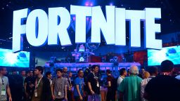 People crowd the display area for the survival game Fortnite at the 24th Electronic Expo, or E3 2018, in Los Angeles, California on on June 12, 2018, where hardware manufacturers, software developers and the video game industry present their new games. (Photo by Frederic J. BROWN / AFP)        (Photo credit should read FREDERIC J. BROWN/AFP/Getty Images)