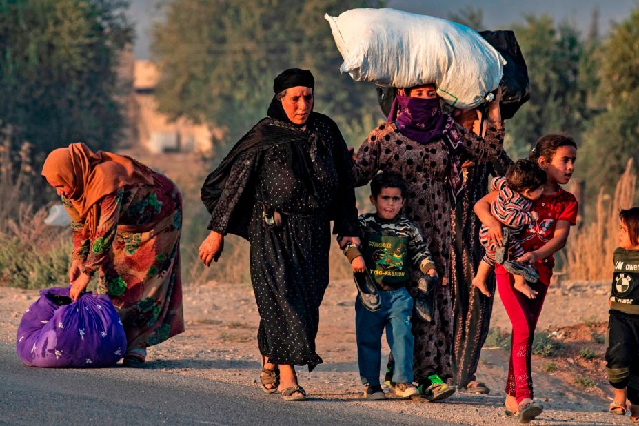 Refugees leave their homes near the Turkey-Syria border.