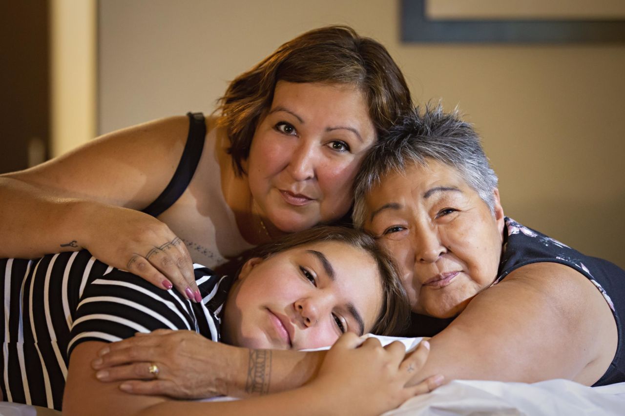 <strong>Three women: </strong>Three generations of women and their traditional Inuit tattoos are featured in this image -- Cora DeVos (left), her mother, a residential school survivor (right) and her daughter (below).
