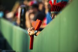 A Braves fan holds a foam tomahawk.