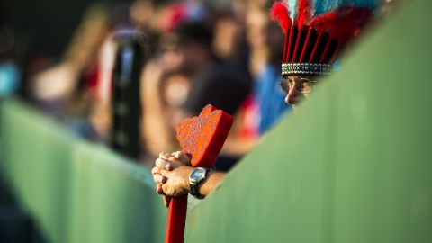 A Braves fan holds a tomahawk during an MLB game against the Cincinnati Reds on July 12, 2013, in Atlanta, Georgia.