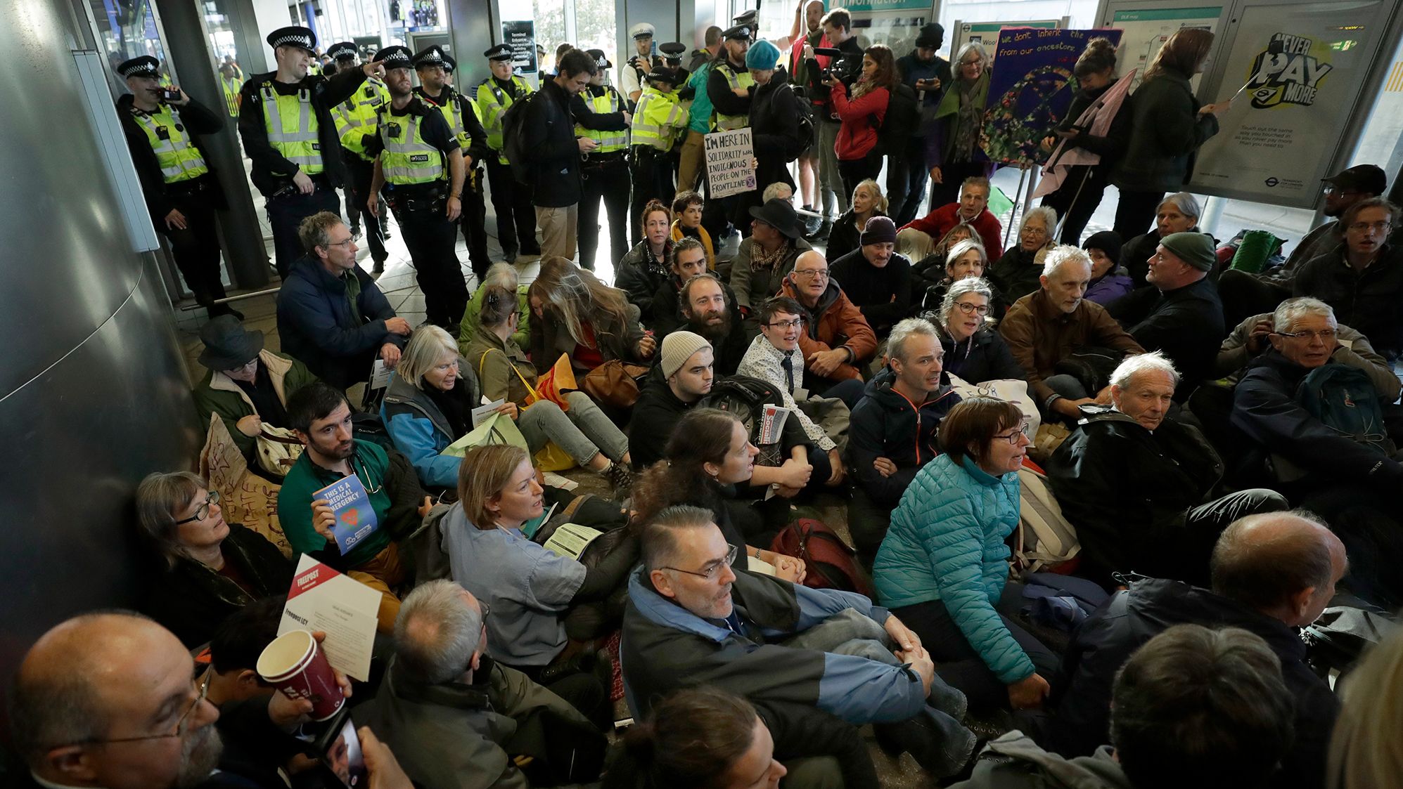 Extinction Rebellion demonstrators block an entrance to the City Airport in London on October 10.