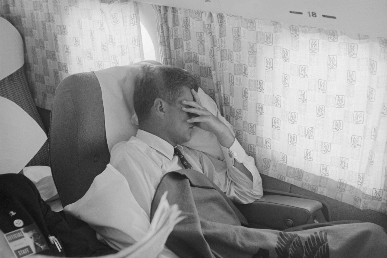 During his 1960 campaign, John F. Kennedy catches some rest while en route from St. Louis to New York City.