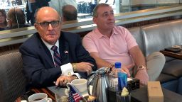 President Trump's personal lawyer Rudy Giuliani has coffee with Ukrainian-American businessman Lev Parnas at the Trump International Hotel in Washington, September 20.