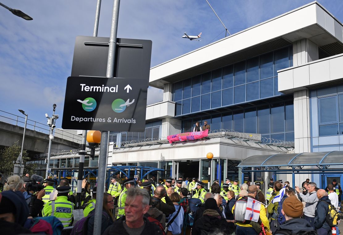 Demonstrators protest at London City Airport.