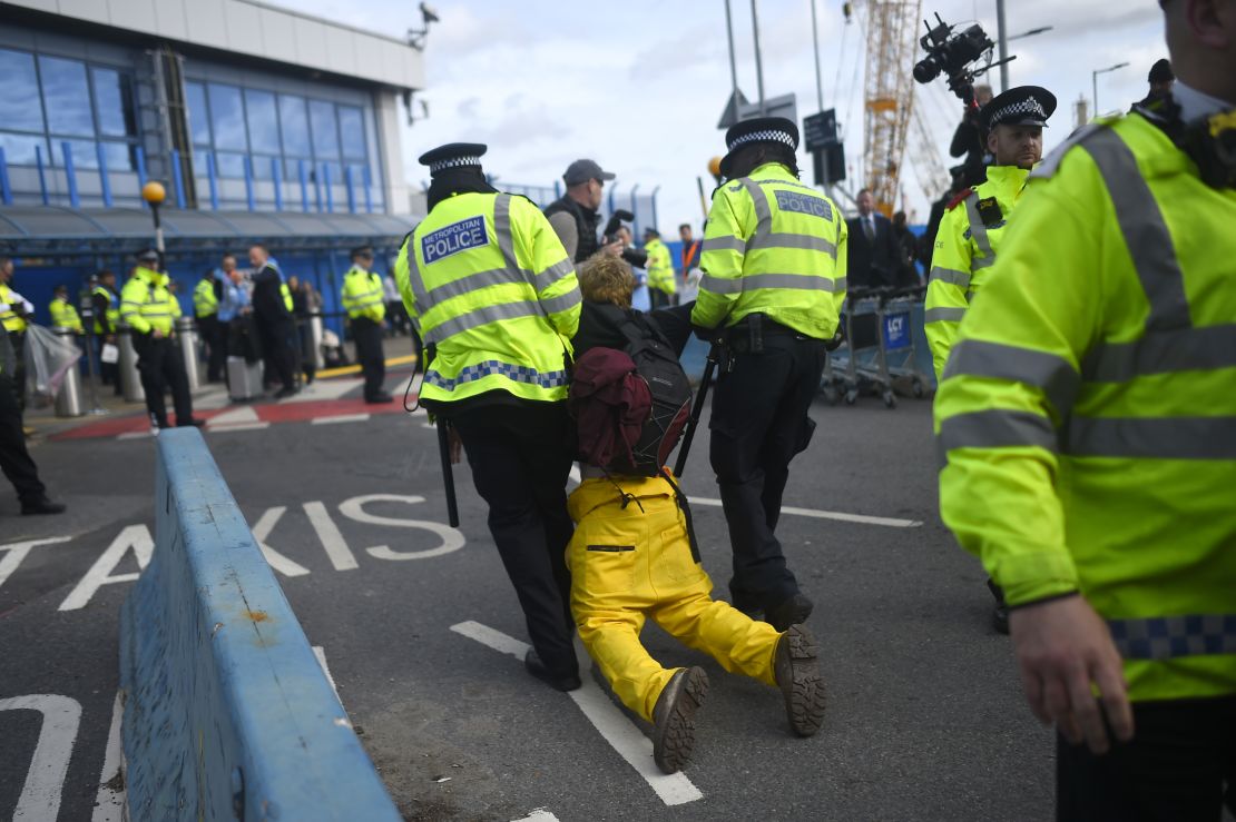 A protester is removed by police as Extinction Rebellion stage a protest at London City Airport on October 10. 