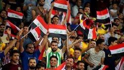 Iraq fans cheer during the 2019 West Asian Football Federation (WAFF) Championship Final football match between Iraq and Bahrain at the Karbala sports city on August 14, 2019. (Photo by AHMAD AL-RUBAYE / AFP)        (Photo credit should read AHMAD AL-RUBAYE/AFP/Getty Images)
