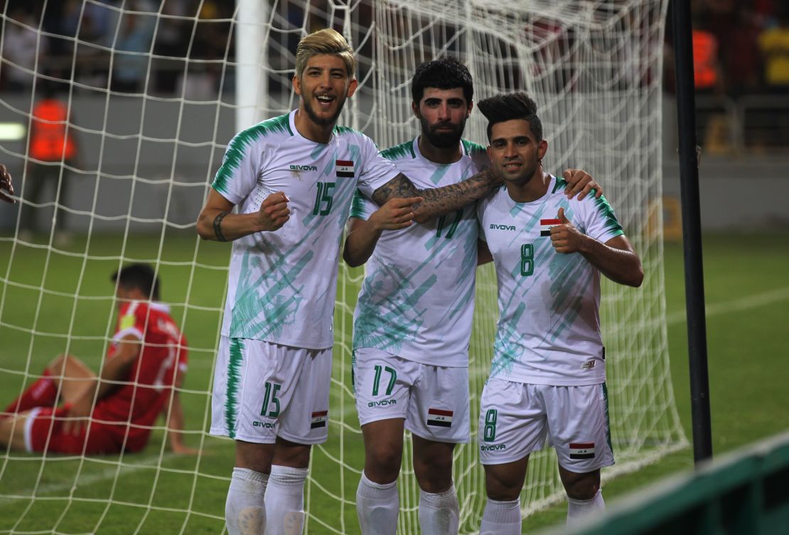 Iraq midfielder Ali Hussein (R) celebrates his goal during the the 2019 WAFF Championship match between Iraq and Lebanon in Karbala on July 30, 2019