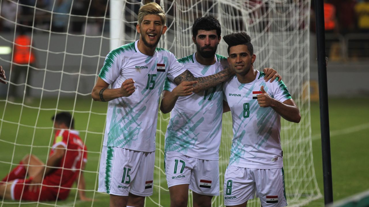 Iraq midfielder Ali Hussein (R) celebrates his goal during the the 2019 WAFF Championship match between Iraq and Lebanon in Karbala on July 30, 2019