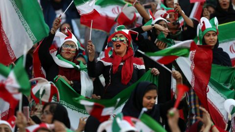 Iranian women cheer during a soccer match between their national team and Cambodia in the 2022 World Cup qualifier at the Azadi Stadium in Tehran, Iran, Thursday, Oct. 10, 2019.