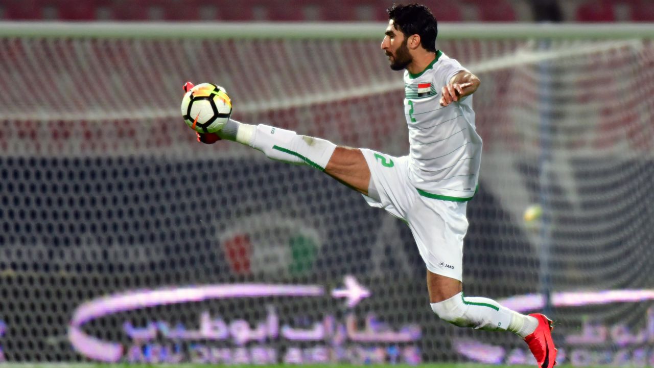 Ahmad Ibrahim stops the ball in mid-air during his 2017 Gulf Cup of Nations football match between Iraq and Bahrain in Kuwait City on December 23, 2017.