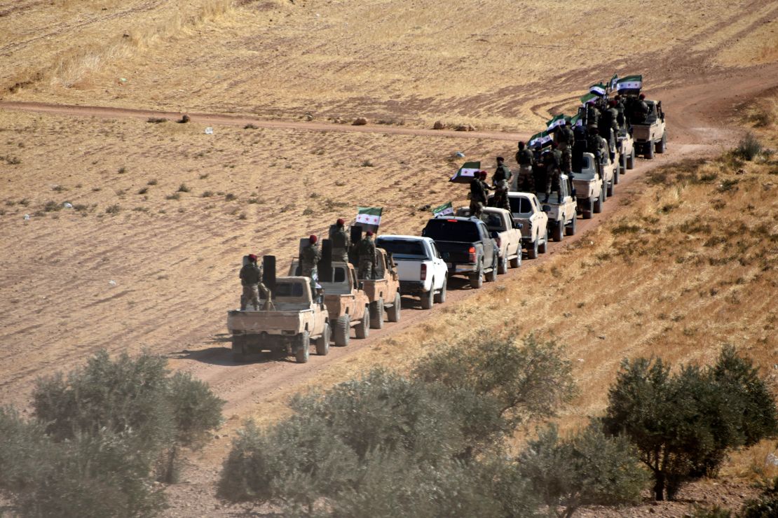Turkey-backed fighters head toward the Syrian town of Tal Abyad. 