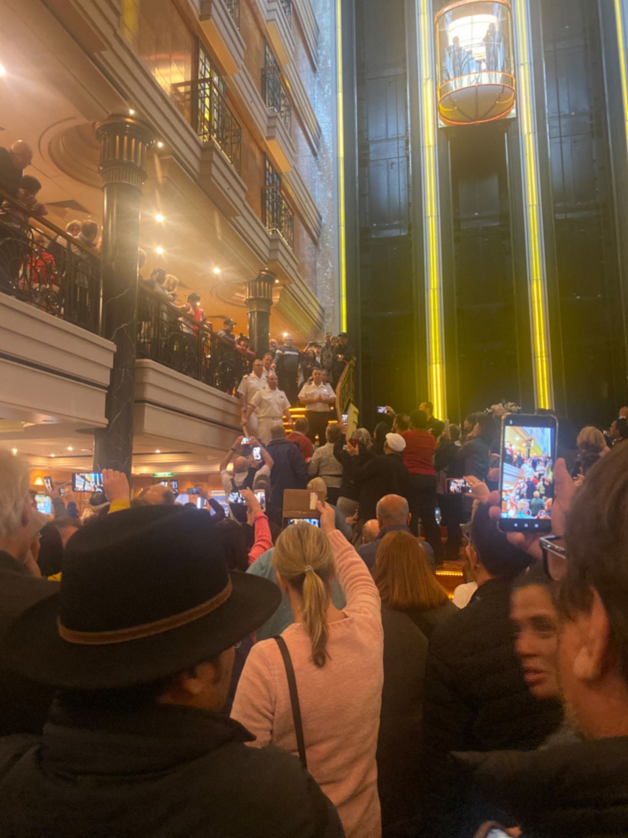 Passengers gathered in the atrium of Norwegian Spirit cruise ship on Monday to protest skipped ports of call.