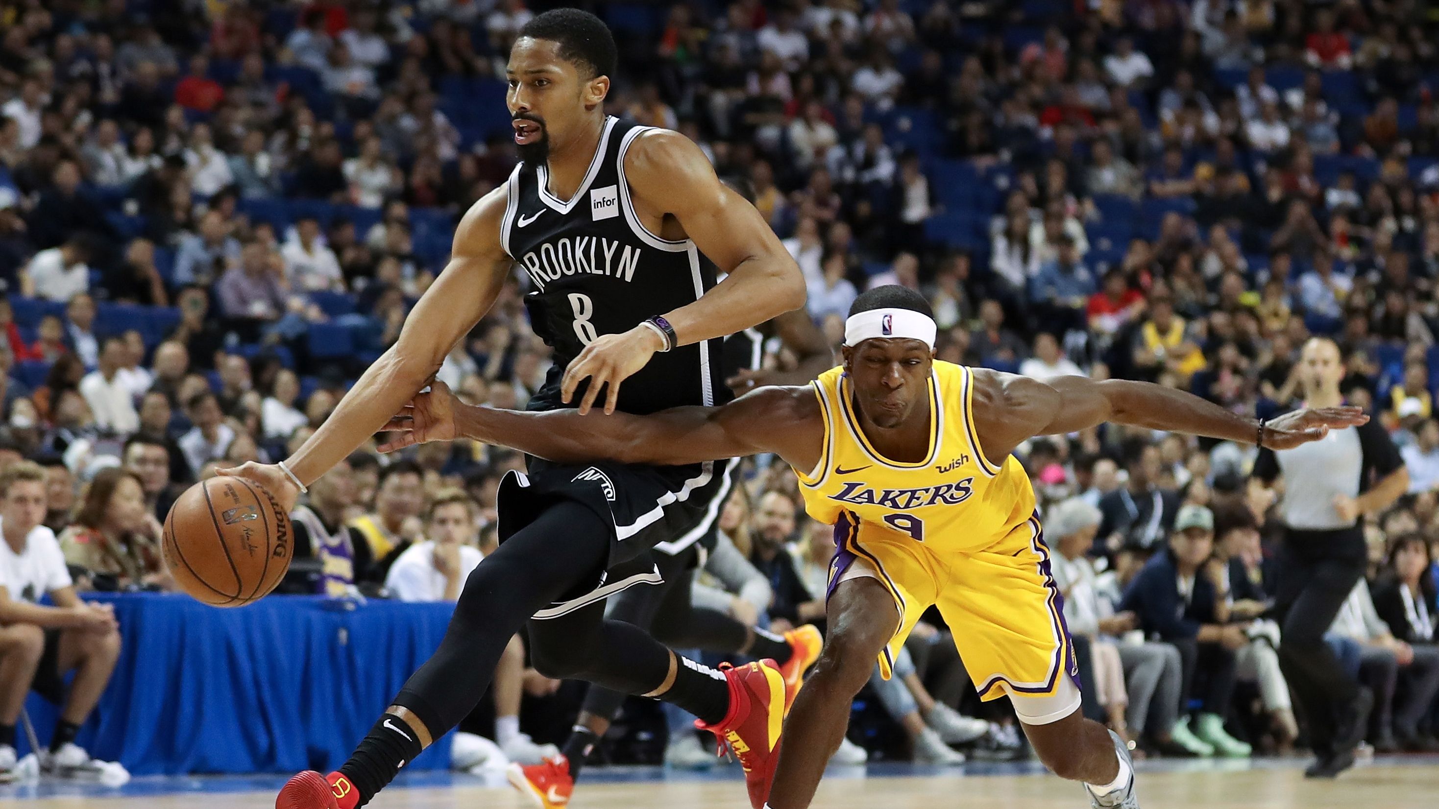 Spencer Dinwiddie #8 of of the Brooklyn Nets in action against Rajon Rondo #9 of the Los Angeles Lakers in Shanghai.