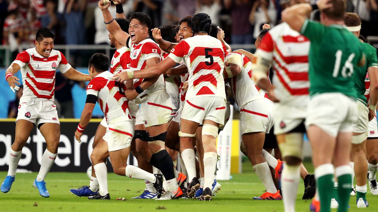 Japanese players celebrate their victory over Ireland. Another win will secure top spot in Pool A.