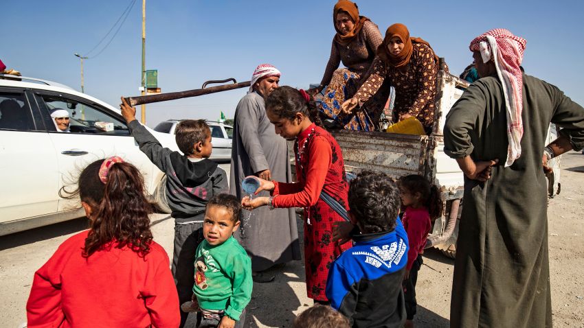 Syrian Arab and Kurdish civilians arrive to Tall Tamr town, in the Syrian northwestern Hasakeh province, after fleeing Turkish bombardment on the northeastern towns along the Turkish border on October 10, 2019. - Syria's Kurds battled to hold off a Turkish invasion on October 9 after air strikes and shelling launched a long-threatened operation that could reshape the country and trigger a humanitarian crisis. (Photo by Delil SOULEIMAN / AFP) (Photo by DELIL SOULEIMAN/AFP via Getty Images)