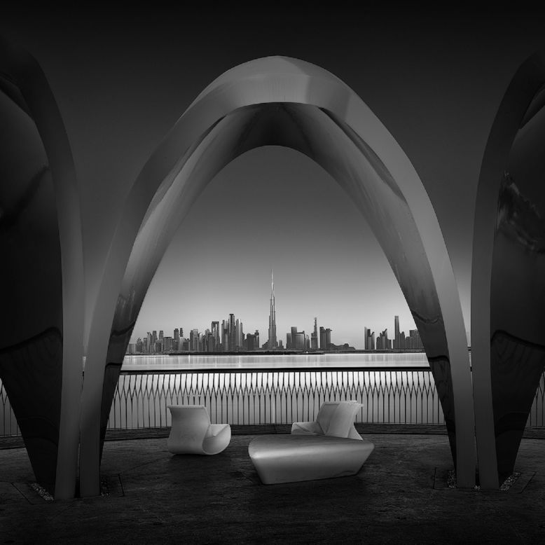 A view of the Dubai skyline framed through an arch. 