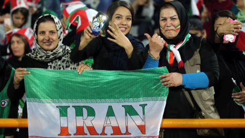 Iranian women cheer during the World Cup qualification match between Iran and Cambodia at the Azadi stadium in the capital Tehran.