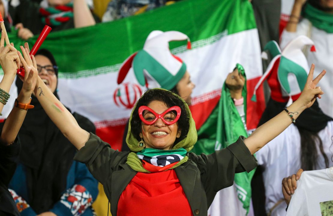 An Iranian woman cheers during the World Cup qualification match between Iran and Cambodia at the Azadi stadium in the capital Tehran on October 10, 2019.