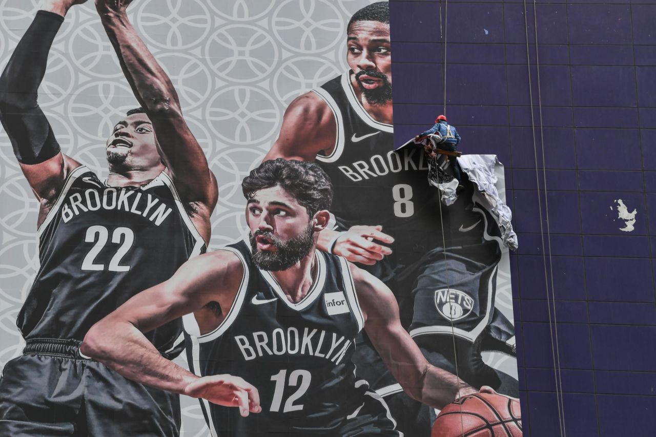A worker removes an NBA billboard in Shanghai, China, on Wednesday, October 9. All of the NBA's official Chinese partners <a href="https://www.cnn.com/2019/10/09/business/nba-china-partners/index.html" target="_blank">suspended ties with the league</a> after the Houston Rockets' general manager, Daryl Morey, tweeted his support for the pro-democracy demonstrations in Hong Kong.