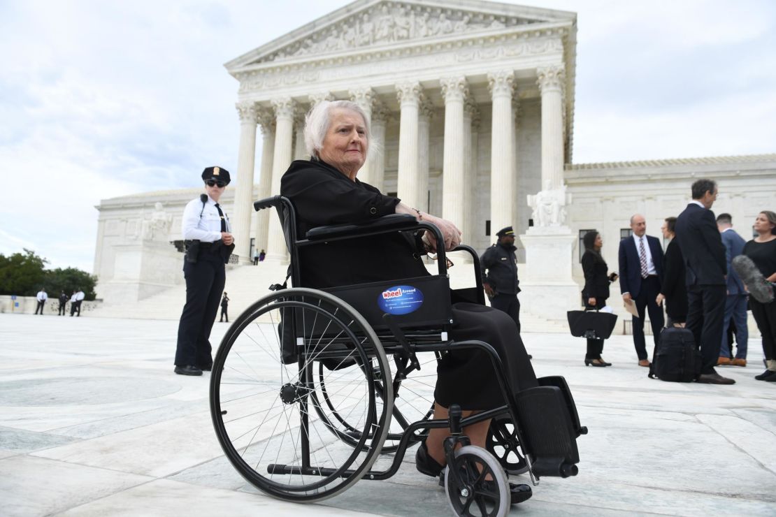 Aimee Stephens sits in her wheelchair outside the US Supreme Court in October 2019 as the court hears oral arguments in cases dealing with workplace discrimination based on sexual orientation. 