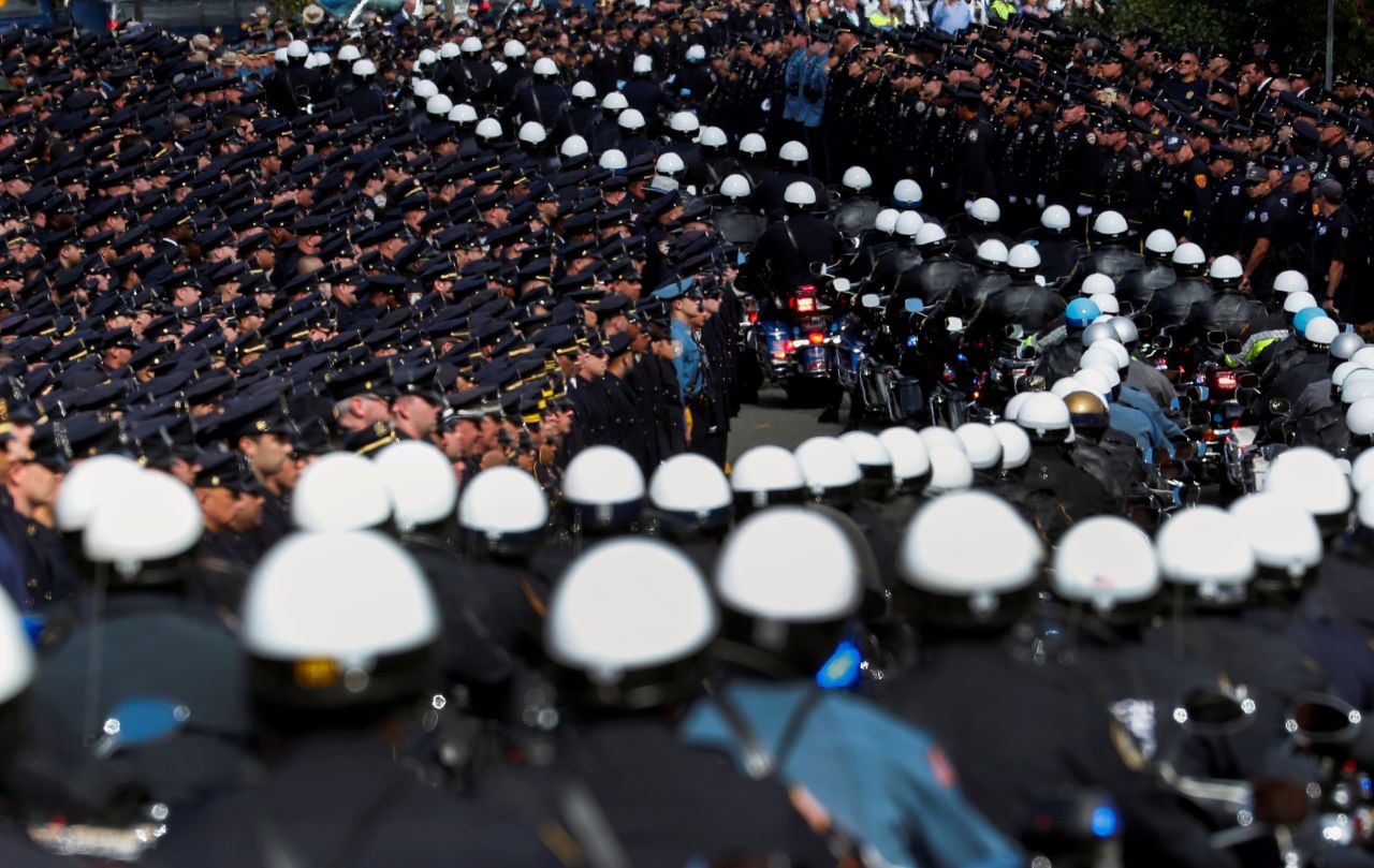 Police motorcycles lead the procession during Brian Mulkeen's funeral service in Monroe, New York, on Friday, October 4. Mulkeen, a 33-year-old member of the New York Police Department, was investigating gang activity when he was fatally shot in September. <a href="https://www.cnn.com/2019/09/30/us/bronx-officer-shot-dead/index.html" target="_blank">Police said it was the result of friendly fire.</a>