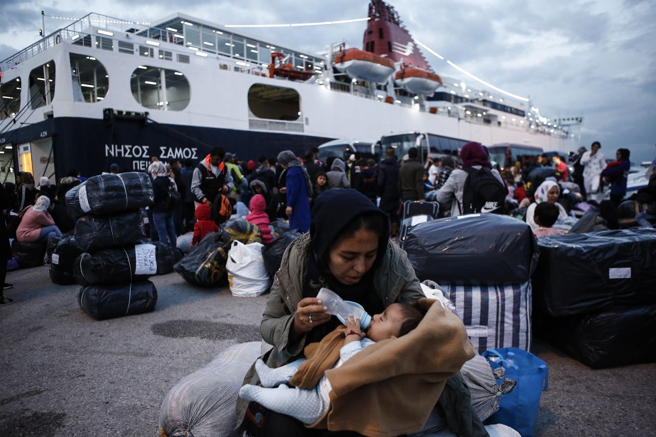 A woman feeds her baby after arriving in the port of Piraeus, Greece, on Monday, October 7. Greece is hosting <a href="https://data2.unhcr.org/en/documents/download/71310" target="_blank" target="_blank">more than 80,000 refugees and asylum seekers.</a>
