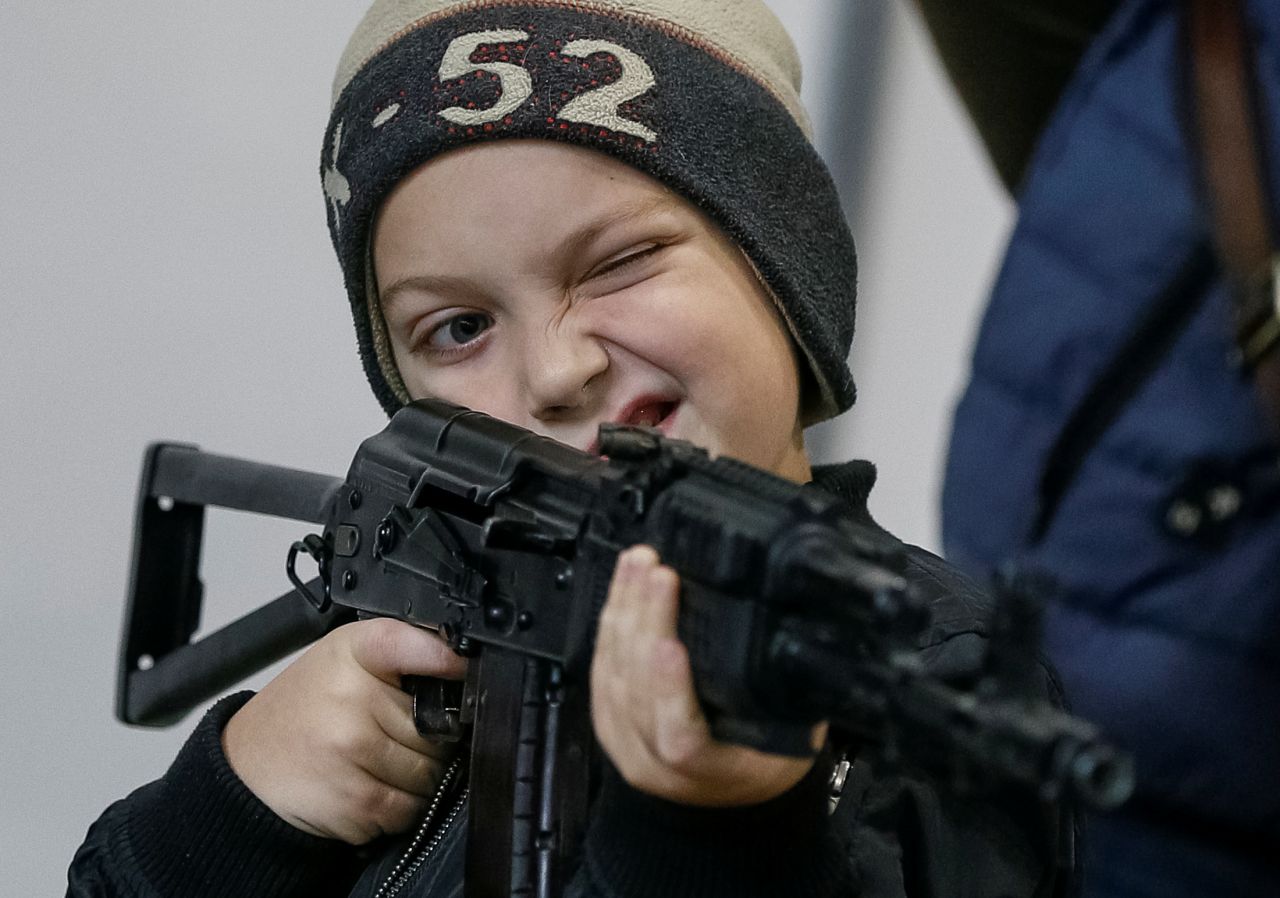 A visitor attends an exhibition of weapons and military equipment in Kiev, Ukraine, on Tuesday, October 8.