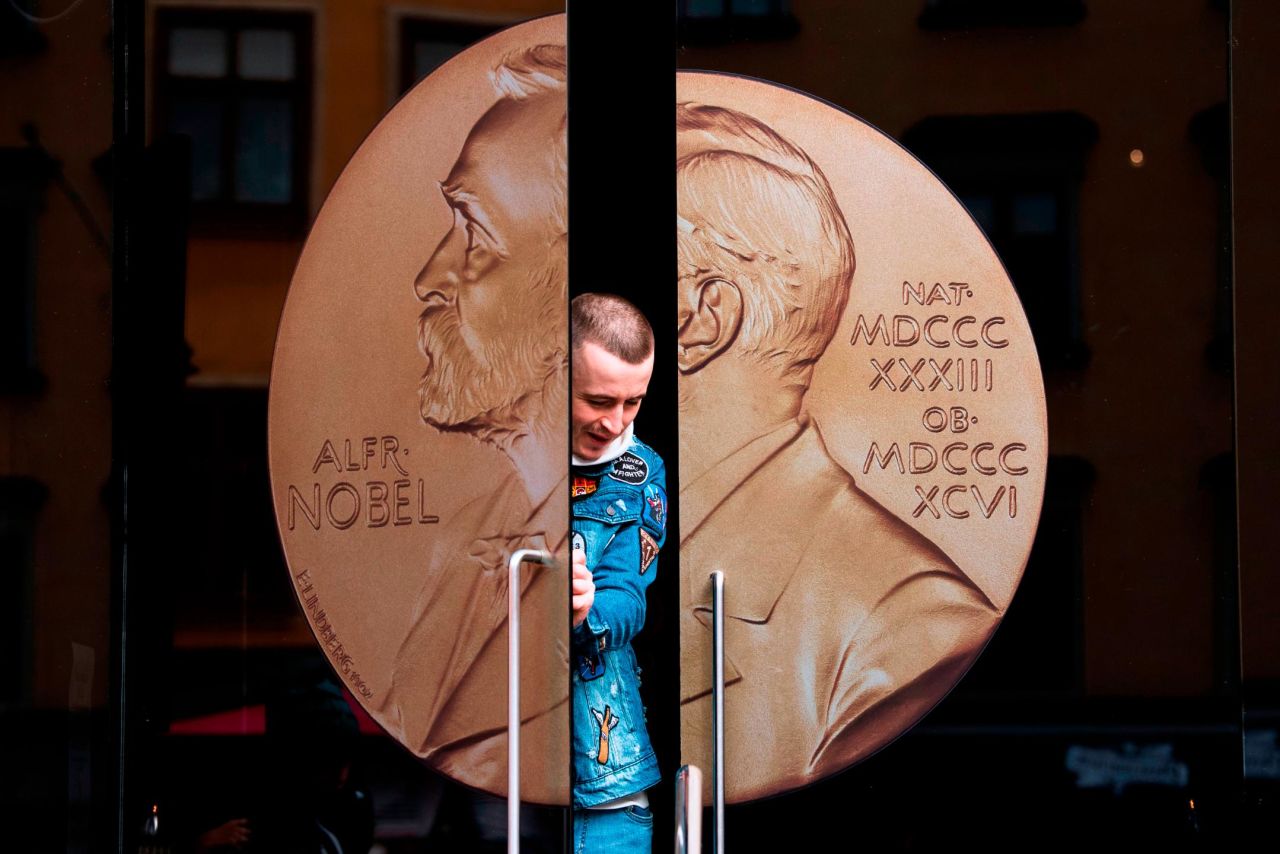 A man opens the door to the Alfred Nobel Museum in Stockholm, Sweden, on Friday, October 4.