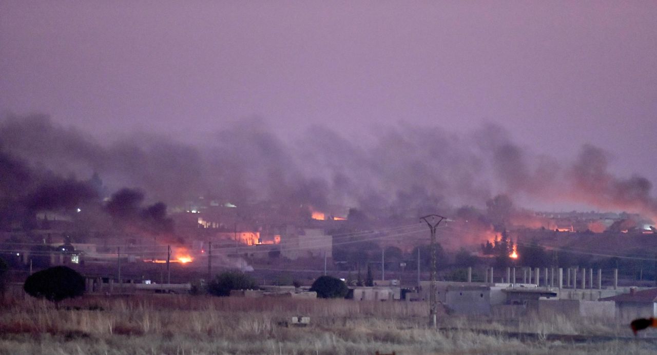 Smoke rises from the Syrian city of Ras al-Ayn after <a href="http://www.cnn.com/2019/10/09/middleeast/gallery/turkey-syria-conflict/index.html" target="_blank">Turkey launched a military offensive in northeastern Syria</a> on Wednesday, October 9.
