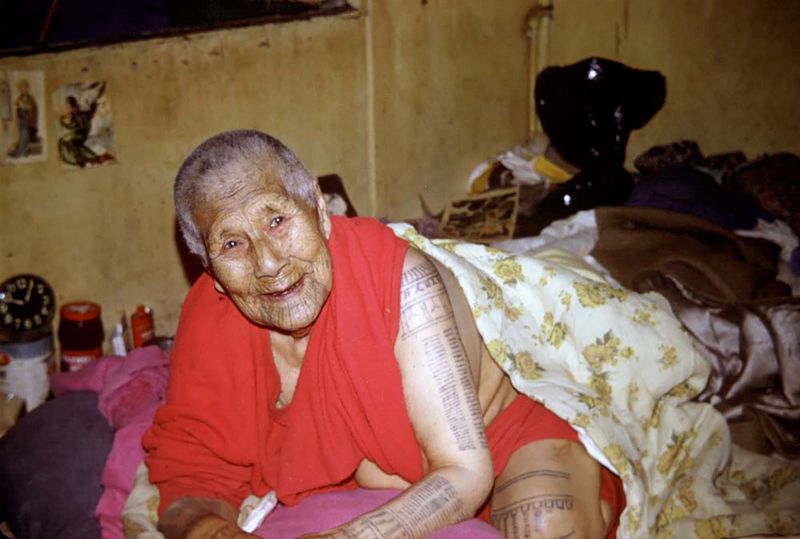 the tattooed hands of a traditional old Black Lu woman in   Flickr