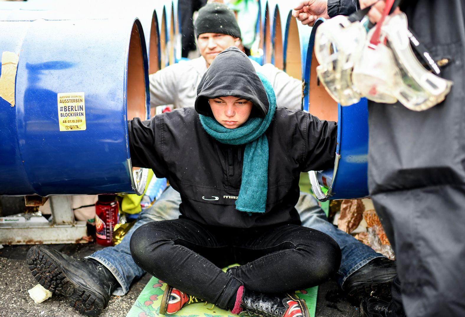 Protesters chain themselves to barrels on Berlin's Marschall Bridge.