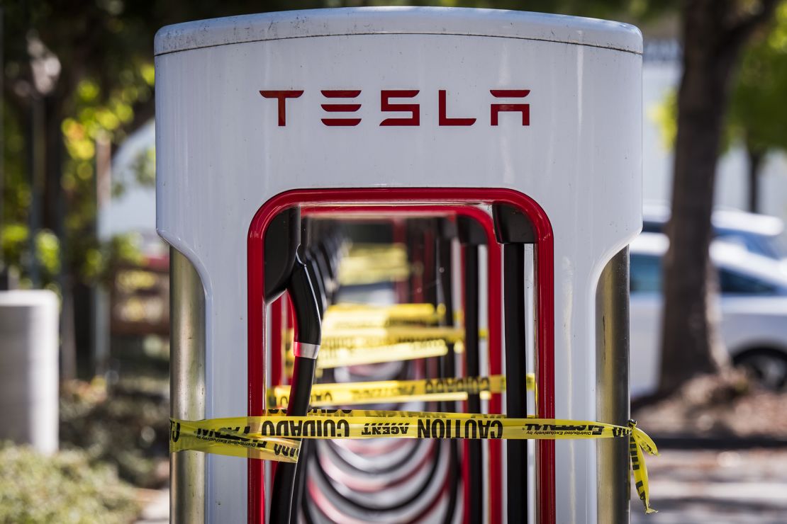 Tesla chargers in San Ramon, California, are tied off with caution tape as PG&E's massive blackout swept across Northern California.