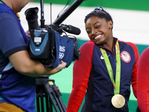 Biles reacts to a camera after winning the individual all-around final at the 2016 Olympics.