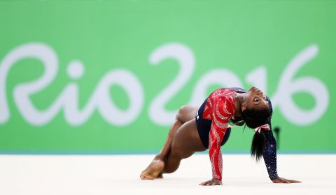 Biles competes on the floor at the 2016 Olympics.