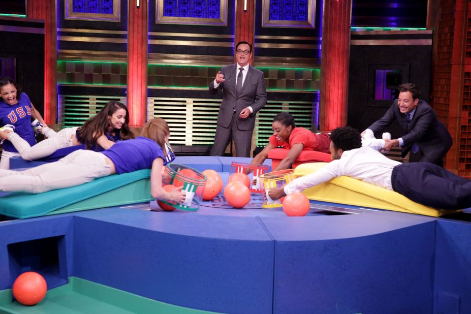 Biles has her legs held by host Jimmy Fallon as she plays a game called Hungry Hungry Humans on "The Tonight Show" in August 2016. Also playing were actor Donald Glover and some of Biles' teammates.