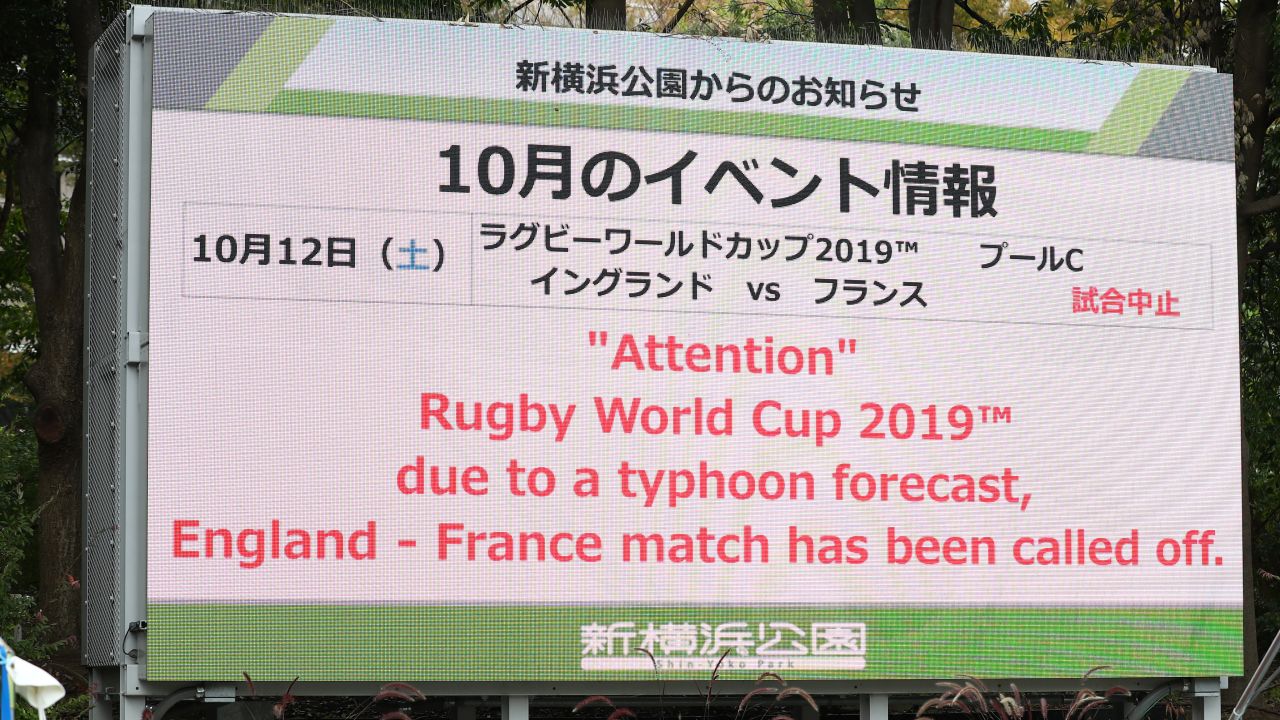 A sign outside of the Yokohama Stadium informs of the cancellation of the England v France game. The game between Japan and Scotland at the same venue remains in doubt.