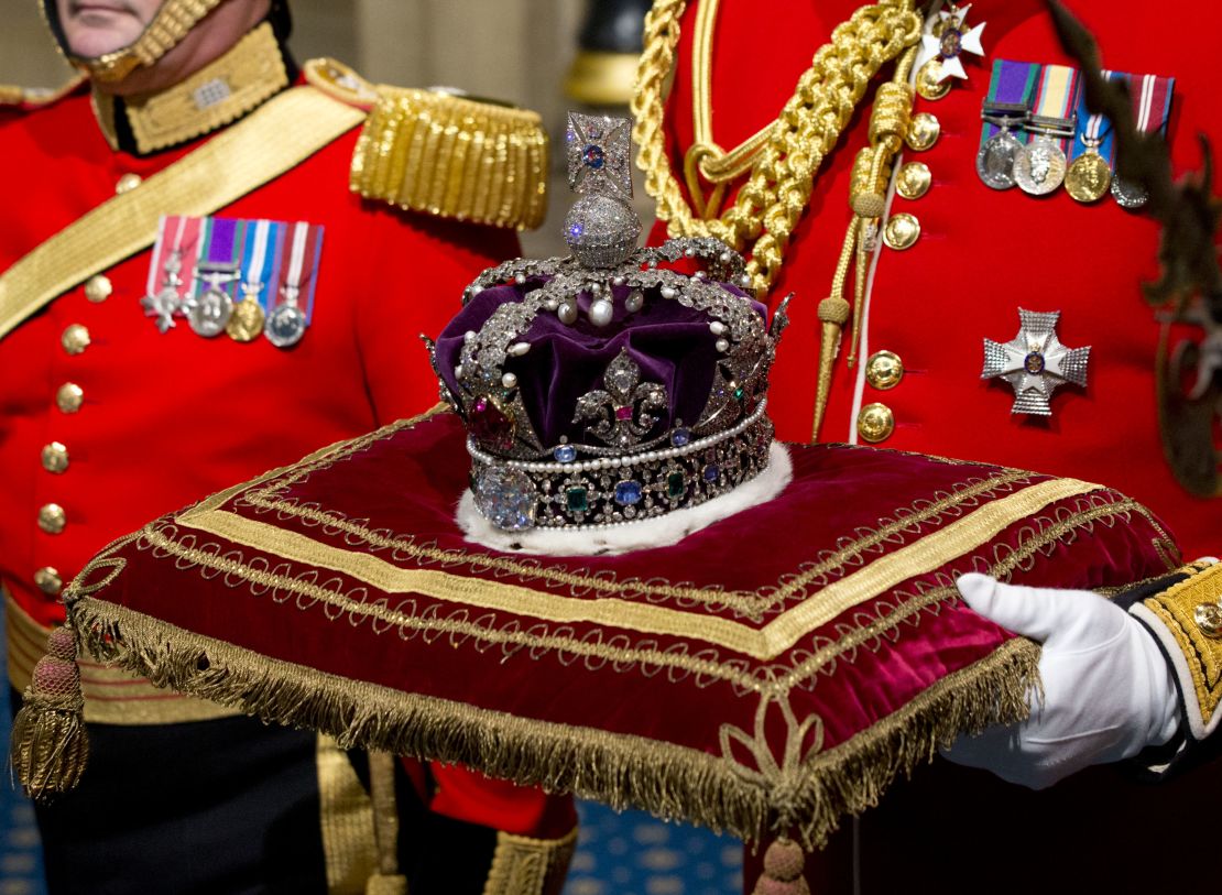 Queen Elizabeth II's Imperial State Crown is carried through Norman Porch ahead of the State Opening of Parliament in 2016.