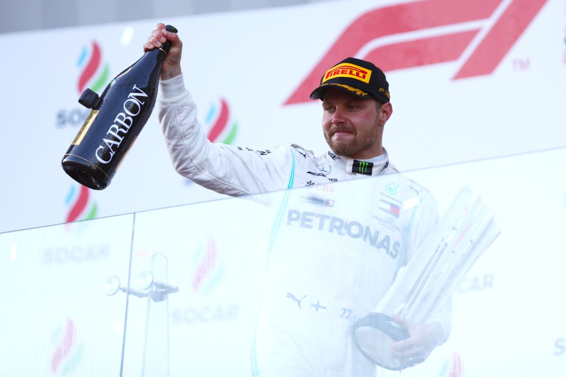 Bottas celebrates on the podium after winning the Azerbaijan Grand Prix.
