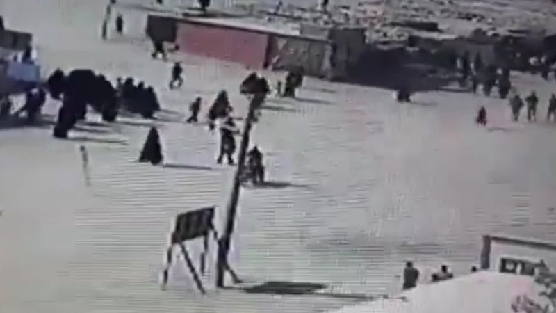 shows ISIS family members attempting camp escape