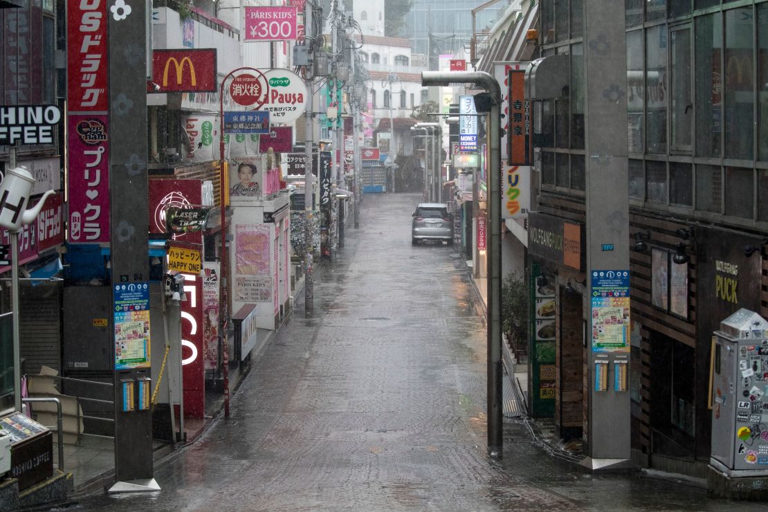 Takeshita street, one of the most crowded and well-known shopping areas in the city, is pictured completely deserted in the Harajuku district of Tokyo.