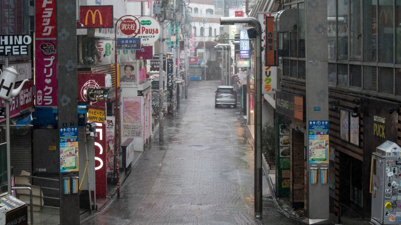 Takeshita street, one of the most crowded and well-known shopping areas in the city, is pictured completely deserted in the Harajuku district of Tokyo.