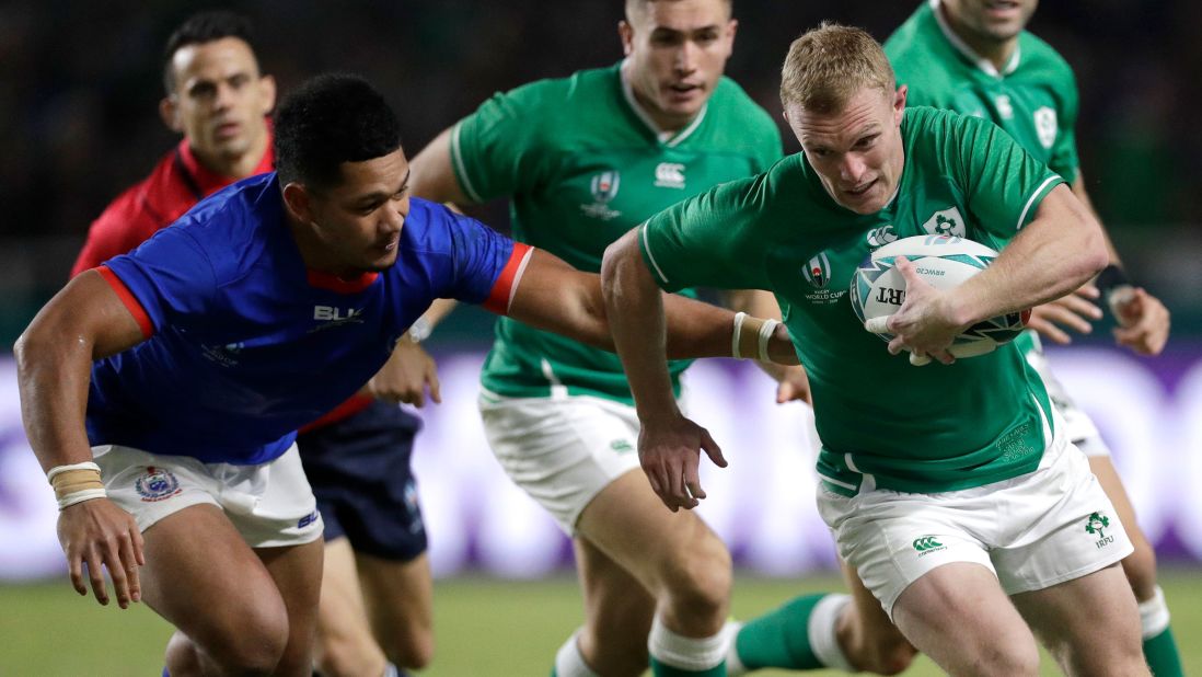 Ireland's Keith Earls runs past the Samoan defense during the Rugby World Cup Pool A game at Fukuoka Hakatanomori Stadium between Ireland and Samoa, in Fukuoka on Saturday. 