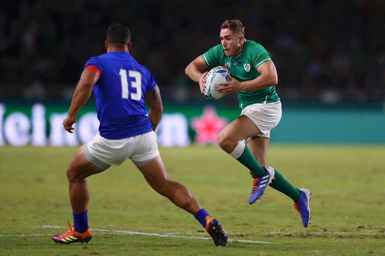 Jordan Larmour of Ireland runs with the ball towards Alapati Leiua of Samoa. The game took place in the west of Japan as a typhoon battered Tokyo some 1,100 kilometers away. 