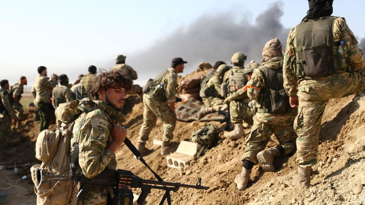 Turkish-backed Syrian rebels and Turkish soldiers during their assault on Kurdish-held border towns in northeastern Syria.