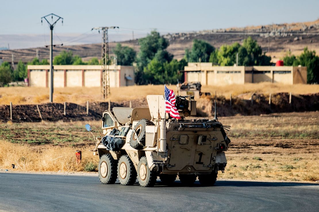 A US military vehicle patrols a road near the town of Tal Baydar in the countryside of Syria's northeastern Hasakeh province on October 12.