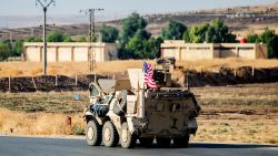 A US military vehicle patrols a road near the town of Tal Baydar in the countryside of Syria's northeastern Hasakeh province on October 12, 2019. - Kurdish forces in northeast Syria Saturday battled a Turkish push along the country's northern border as Ankara's offensive went into its fourth day, following a night of steady advances. Turkey is targeting the Kurdish-led Syrian Democratic Forces (SDF), a key US ally in the five-year battle to crush the Islamic State group. The SDF lost 11,000 fighters in the US-led campaign. (Photo by Delil SOULEIMAN / AFP) (Photo by DELIL SOULEIMAN/AFP via Getty Images)