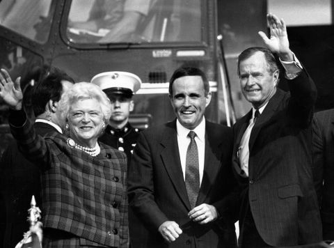 Giuliani greets US President George H.W. Bush and first lady Barbara Bush at a Wall Street heliport in September 1989. Giuliani, who had resigned as US attorney, was running for mayor of New York. He lost a close race to David Dinkins that year, but the two would face off again four years later.